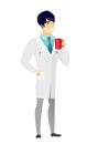 Young asian doctor holding cup of coffee.