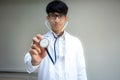 Young Asian doctor with a stethoscope in the hands