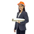 Young asian engineer in gray suit and orange hardhat stand smiling, holding construction drawing of real estate project. Portrait Royalty Free Stock Photo