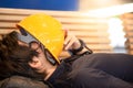 Young Asian engineer man lying on bench feeling tried Royalty Free Stock Photo