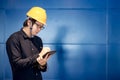 Young Asian engineer man writing on tablet Royalty Free Stock Photo