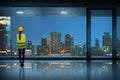 Young asian engineer woman standing seeing through window glass