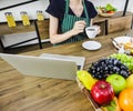 Young Asian entrepreneur or businesswoman work at home by using laptop or computer. Female university student studying e learning