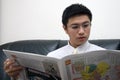 Young Asian Entrepreneur Reading