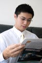 Young Asian Entrepreneur Reading