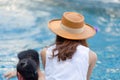 Young Asian family relaxing in swimming pool. Family on vacation having fun by pool, Happiness lifestyle concepts Royalty Free Stock Photo