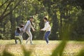 Young asian family with two children enjoying outdoor activity Royalty Free Stock Photo