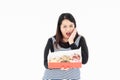 A young Asian fat woman has a donut in her hand Royalty Free Stock Photo