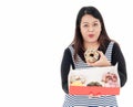 A young Asian fat woman has a donut in her hand Royalty Free Stock Photo