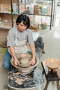 Young asian female ceramicist in apron Royalty Free Stock Photo