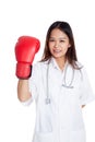 Young Asian female doctor with boxing glove Royalty Free Stock Photo