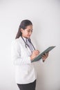 Young asian Female doctor, holding a clipboard and smiling to ca Royalty Free Stock Photo