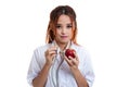 Young Asian female doctor listening to an apple with a stethoscope. Royalty Free Stock Photo