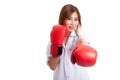 Young Asian female doctor punch with boxing glove Royalty Free Stock Photo