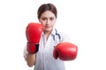 Young Asian female doctor punch with boxing glove. Royalty Free Stock Photo