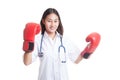 Young Asian female doctor ready to fight. Royalty Free Stock Photo
