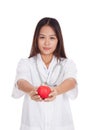 Young Asian female doctor show an apple Royalty Free Stock Photo