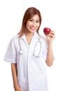 Young Asian female doctor show an apple Royalty Free Stock Photo