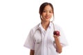 Young Asian female doctor show apple Royalty Free Stock Photo