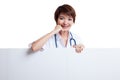 Young Asian female doctor standing behind blank white billboard. Royalty Free Stock Photo