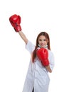 Young Asian female doctor win the fight. Royalty Free Stock Photo