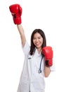 Young Asian female doctor win the fight. Royalty Free Stock Photo