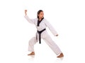 Female martial art fighter striking a pose, full length portrait, white background