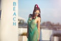 Young asian female enjoying sunny day on tropical beach Royalty Free Stock Photo