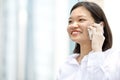 Young Asian female executive talking on phone Royalty Free Stock Photo