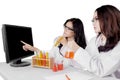 Young Asian female scientists doing research Royalty Free Stock Photo