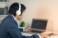 Asian Forex Trader or Investor Wear Headphone and Trading Forex or Stock by Laptop in Vintage Tone