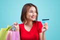 Young asian girl with credit card and shopping bags