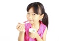 Young asian girl eating yogurt Royalty Free Stock Photo