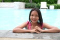 Young Asian girl having fun at swiming pool Royalty Free Stock Photo