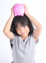 Young asian girl holding piggy bank Royalty Free Stock Photo