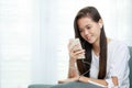 Young Asian girl listening to music with headphone and smarthphone Royalty Free Stock Photo