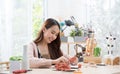 Young Asian girl making a sculpture with modeling clay at home .hobby clay sculpt concept.