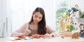 Young Asian girl making a sculpture with modeling clay at home .hobby clay sculpt concept.