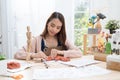 Young Asian girl making a sculpture with modeling clay at home .hobby clay sculpt concept.