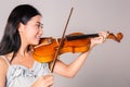 Young asian girl playing violin Royalty Free Stock Photo