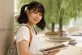 Young Asian girl studying hard in the park Royalty Free Stock Photo