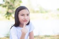 Young girl thinking in park Royalty Free Stock Photo