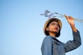 Young asian girl wear Jetket Jean hold grass flower .Blue sky background Royalty Free Stock Photo