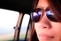 Young asian girl wearing blue sunglasses