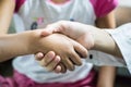 Young Asian Girls Shakehand for Stop Argue in Collaboration Concept