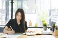 Graphic designer working on computor and graphics tablet in her working space Royalty Free Stock Photo