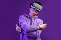 Chinese man using the virtual reality headset gesturing with hands isolated