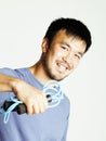 Young asian guy with skipping rope on white background ready to training sport, lifestyle people concept Royalty Free Stock Photo