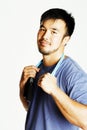 Young asian guy with skipping rope on white background ready to Royalty Free Stock Photo