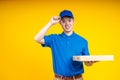 Young Asian handsome delivery man holding a pizza box Royalty Free Stock Photo